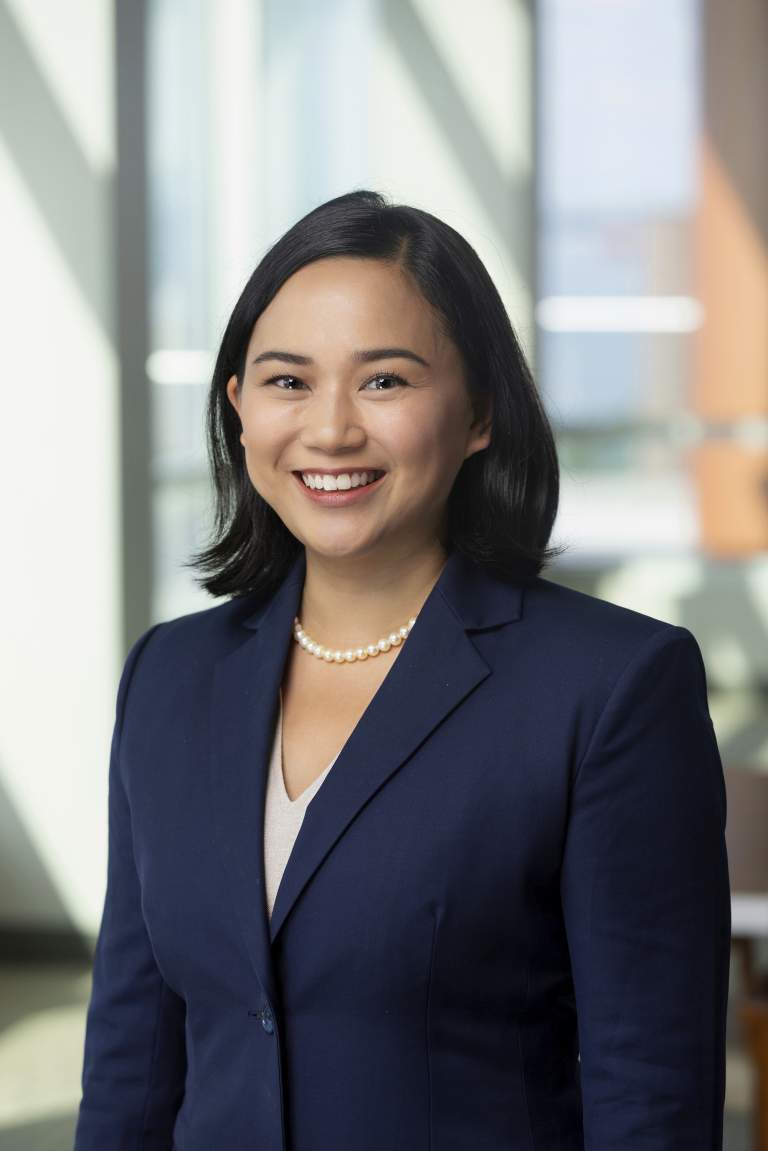 Corporate attorney woman in blue suit and pearls