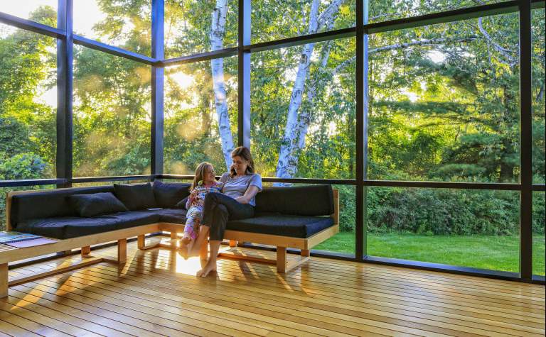 quiet moment in glass room mother and daughter