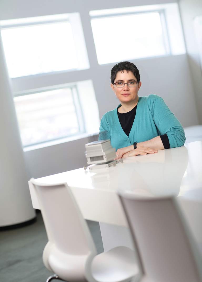 Sarah Bowman associate research scientist in white office setting